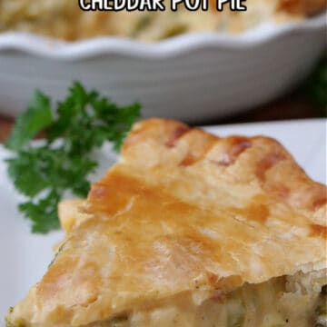 A slice of chicken broccoli cheddar pot pie on a white plate.