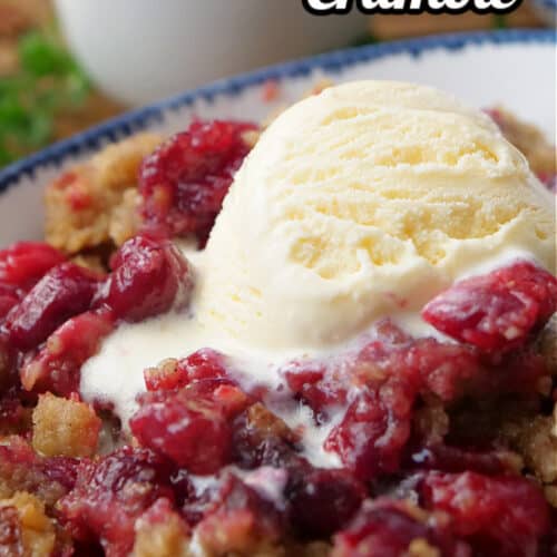 A white bowl filled with cranberry crumble.