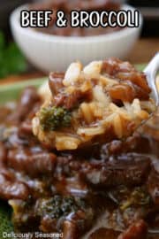 A close up of a spoonful of beef, broccoli, and rice.