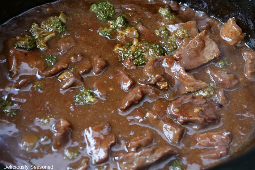 Beef and broccoli in a savory sauce in the crock pot.