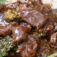 A close up of tender beef and broccoli.