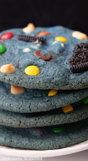 A stack of 4 blue cookie monster cookies.