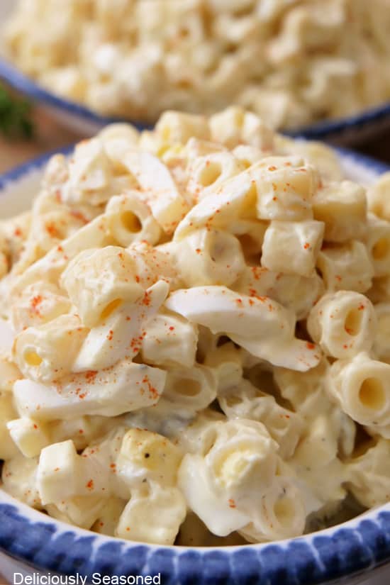 A close up of macaroni pasta salad in a bowl.