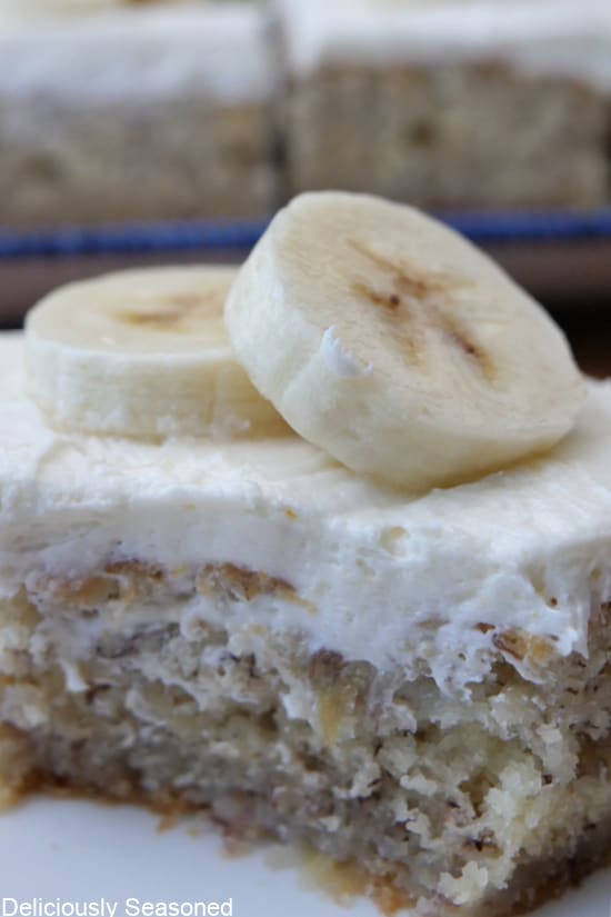 A close up of a banana bar on a white plate.
