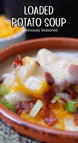 A bowl of loaded potato soup with the title of the recipe at the top of the photo.