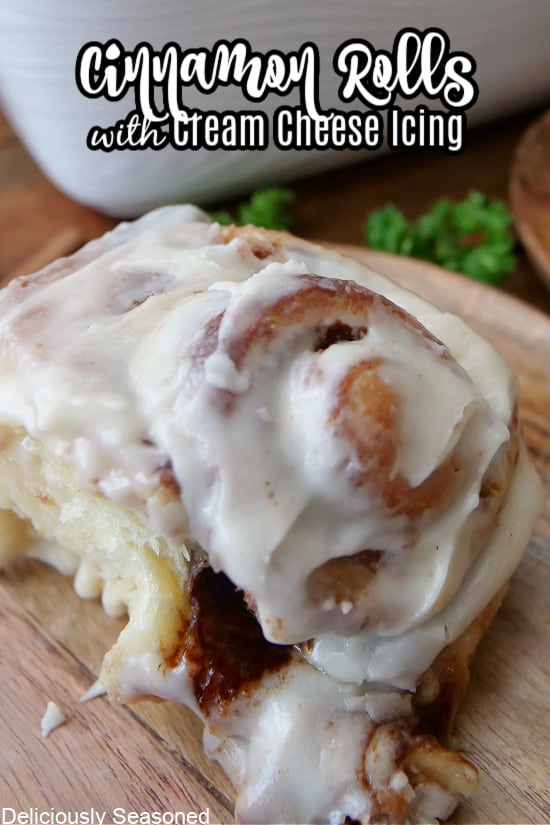 A close up of a homemade cinnamon roll with cream cheese icing.