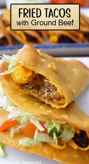 Fried tacos on a white plate.