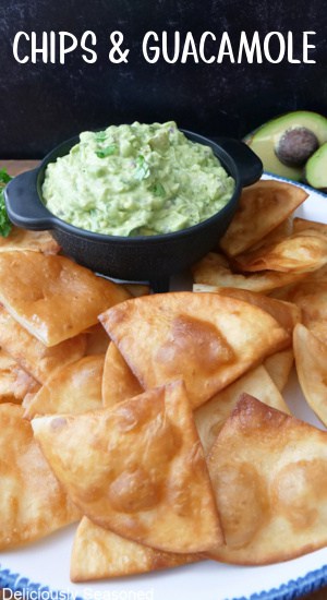 A plate full of homemade deep fried flour tortilla chips with homemade guacamole in a black bowl.