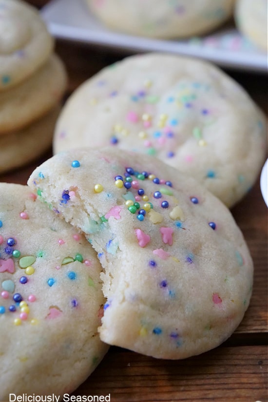 A close up photo of sugar cookies with pastel Easter sprinkles.