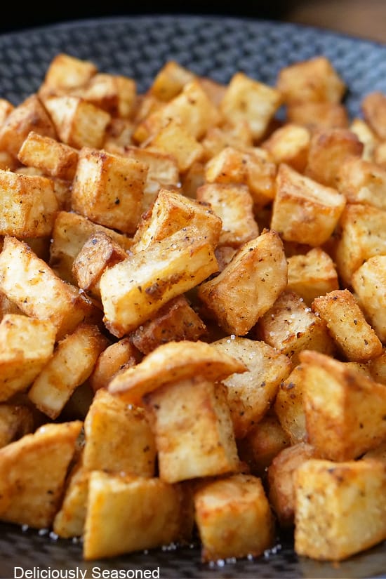 A close up of air fried diced potatoes.