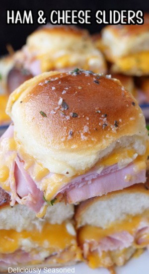 A close up of ham and cheese sliders.