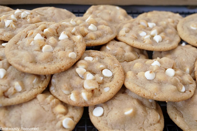 A couple dozen cookies pile up on each other.