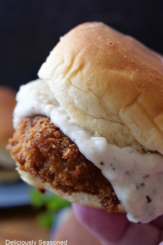 A close up of a chicken fried steak slider.