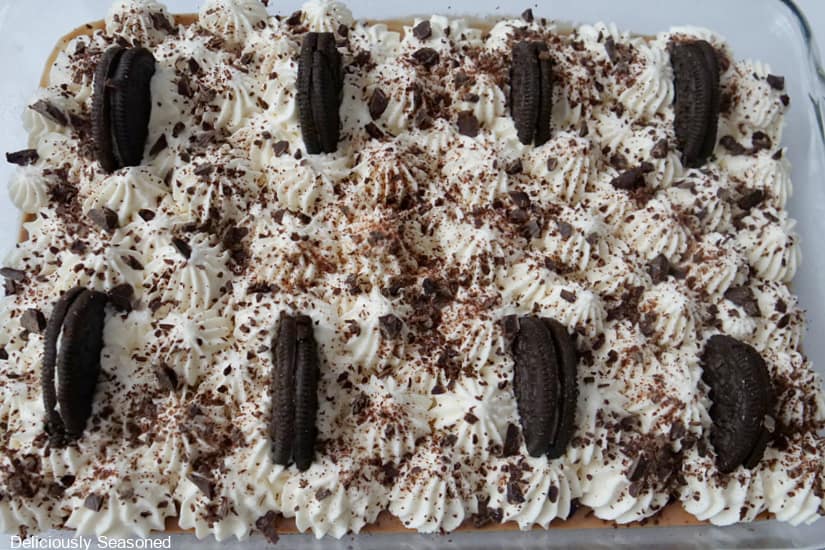 An overhead photo of a glass 11 by 7 baking dish filled with chocolate cream dessert bars in it before cutting them into servings.