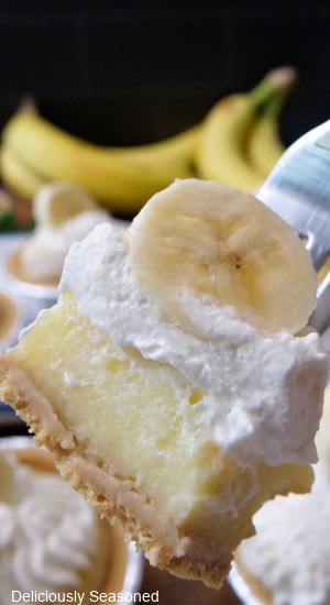A bite of banana cream pie on a fork.