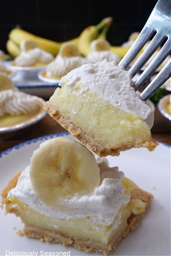 A bite of mini banana cream pie on a fork.