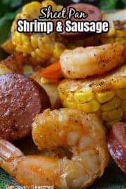 A close up of shrimp, sausage, potatoes and sliced corn on the cob, with the title of the recipe at the top of the picture.