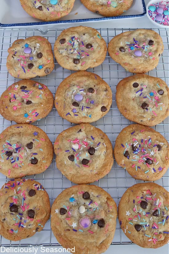 A wire rack with twelve Spring Cookies on it cooling.
