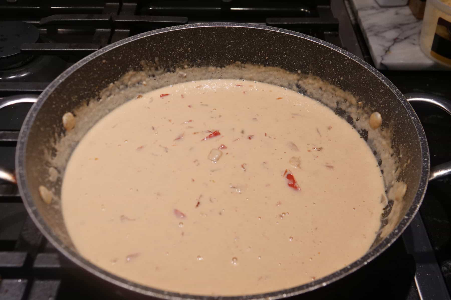 A creamy sauce in a skillet.
