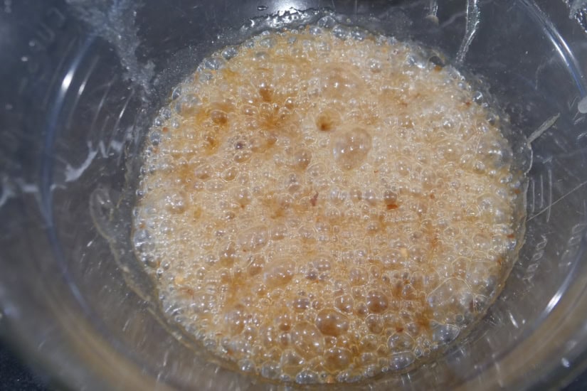 A glass bowl with corn syrup and sugar after being microwave.