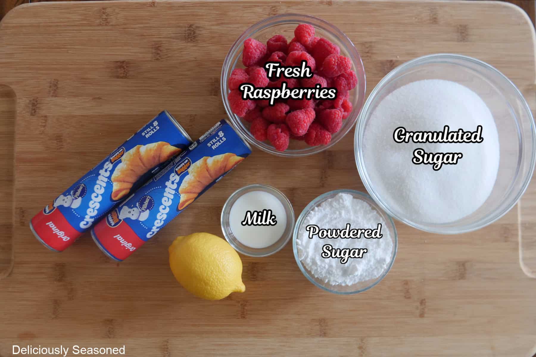 A wood surface with the ingredients to make raspberry twists.