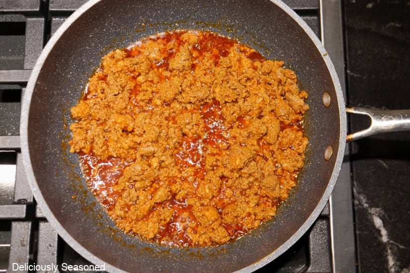 A pan with cooked chorizo in it.