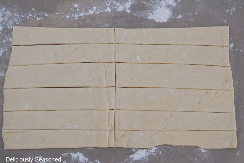 A crescent dough cut into 12 strips.