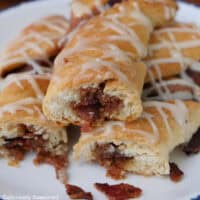 A small stack of maple bacon twists on a white plate with blue trim with a title overlay at the top.