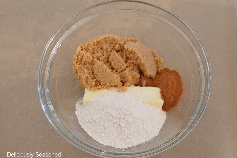 A glass bowl with the streusel ingredients in it before being mixed together.