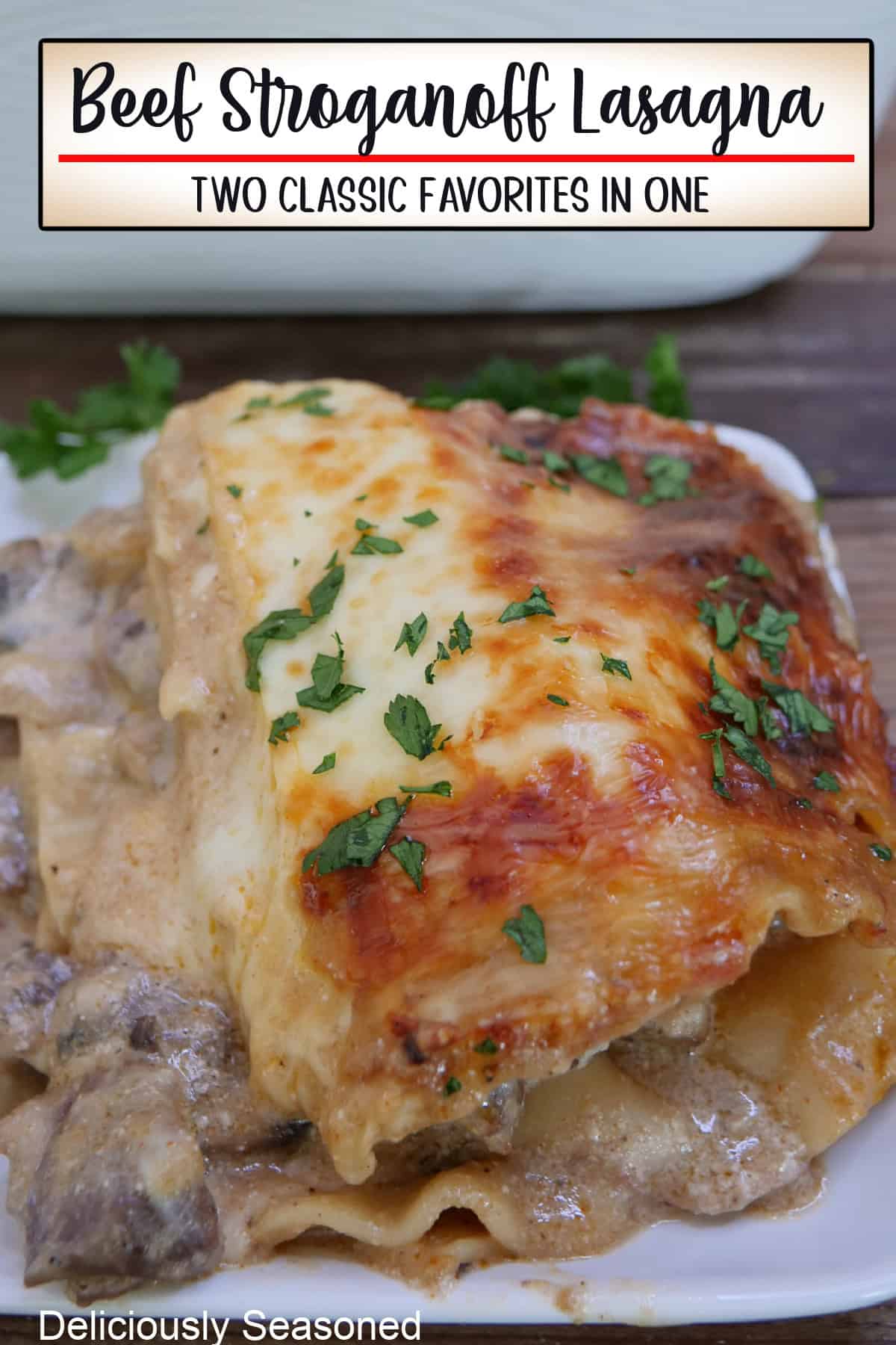 A white plate with a serving of beef stroganoff lasagna on it, with a title overlay at the top.