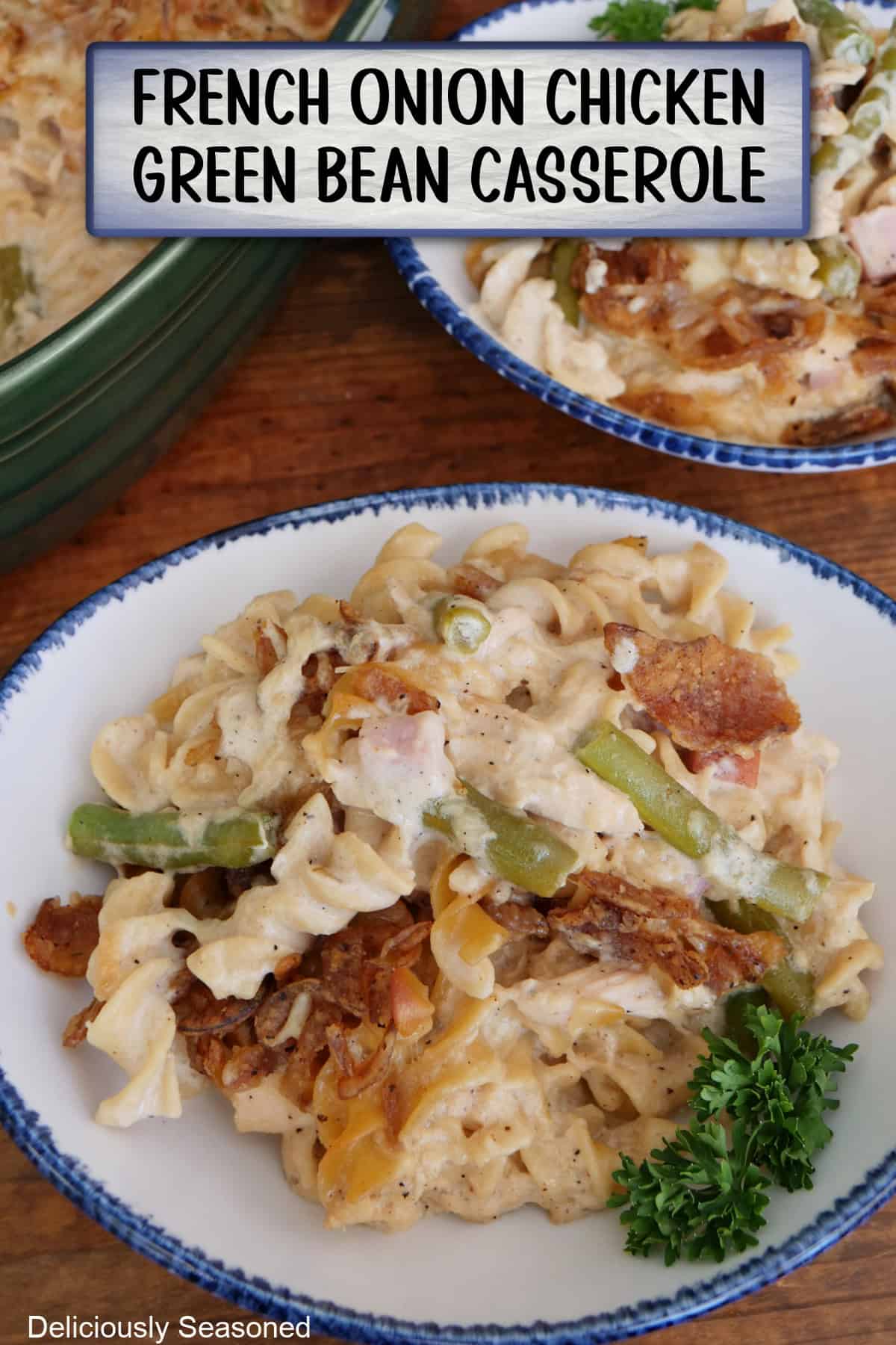 A white bowl with blue trim with a serving of French onion chicken green bean casserole in it, and a title overlay at the top.