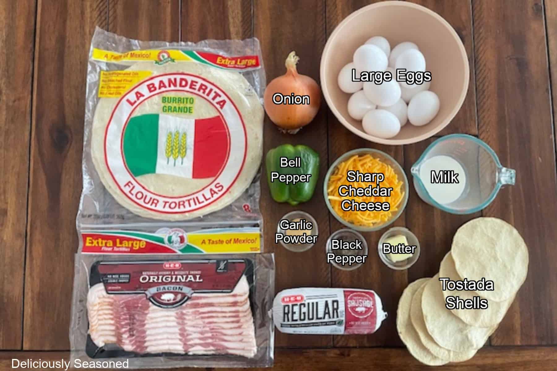 A wood surface with all the ingredients place on it to make breakfast crunchwraps.