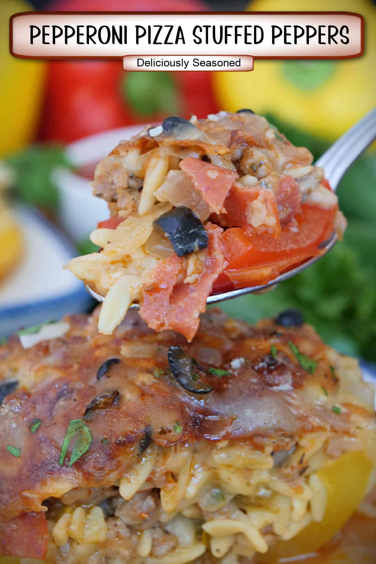 A bite of pepperoni pizza stuffed pepper on a spoon held above a plate, and a title overlay at the top.