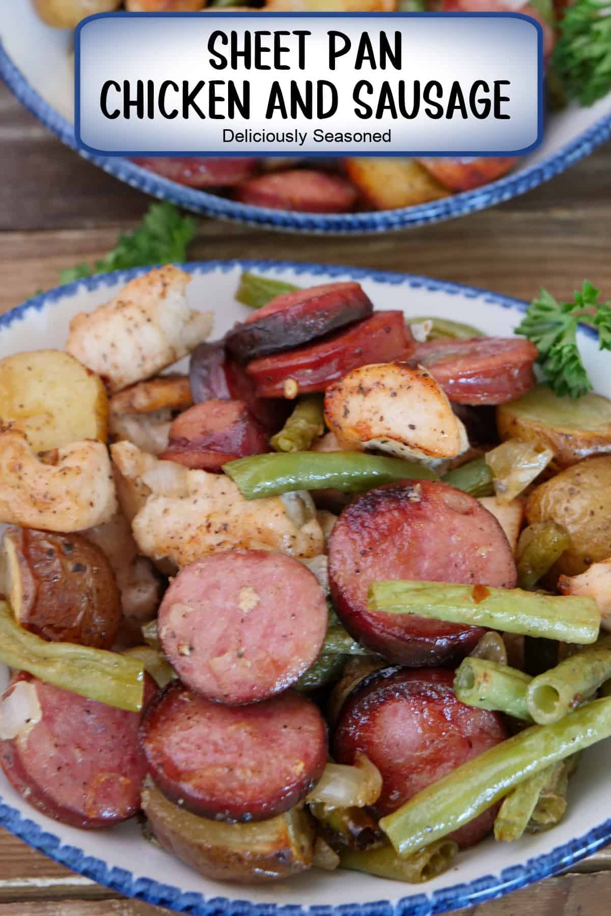 A white bowl with blue trim filled with a serving of chicken, sausage, green beans and potatoes, and a title overlay at the top.