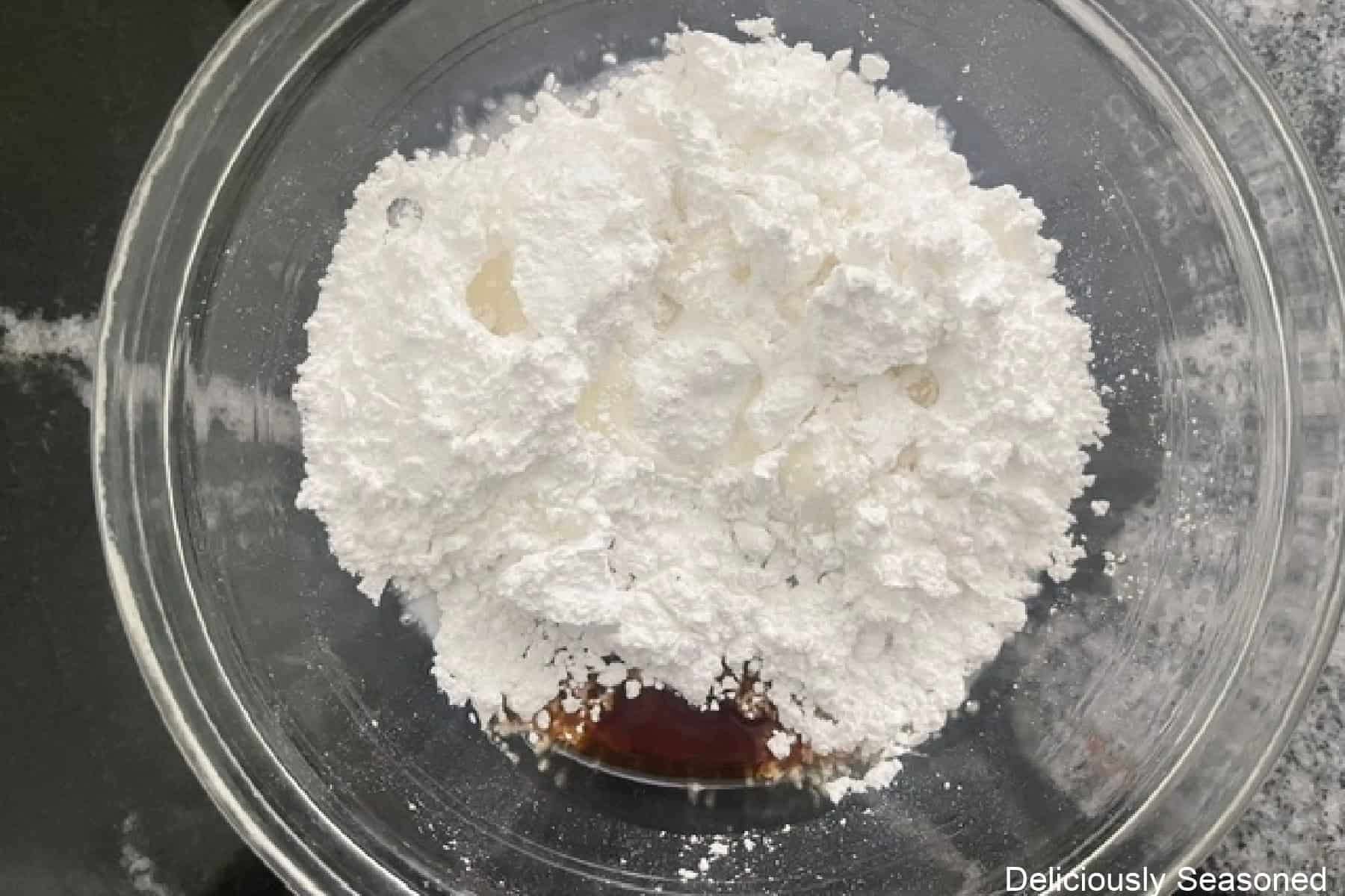 A glass bowl with the glaze ingredients in it before being mixed together.