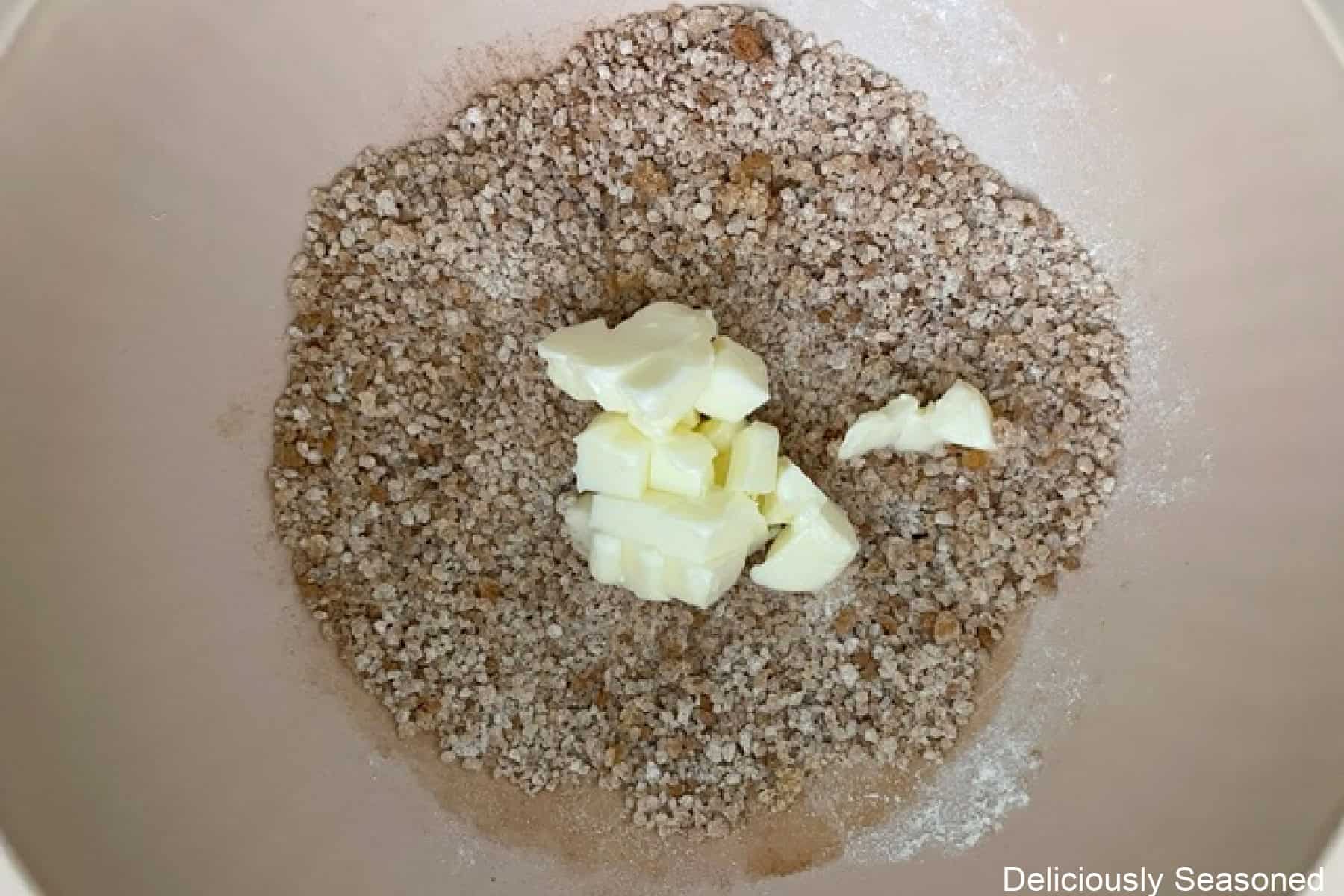 A mixing bowl with streusel topping ingredients in it.