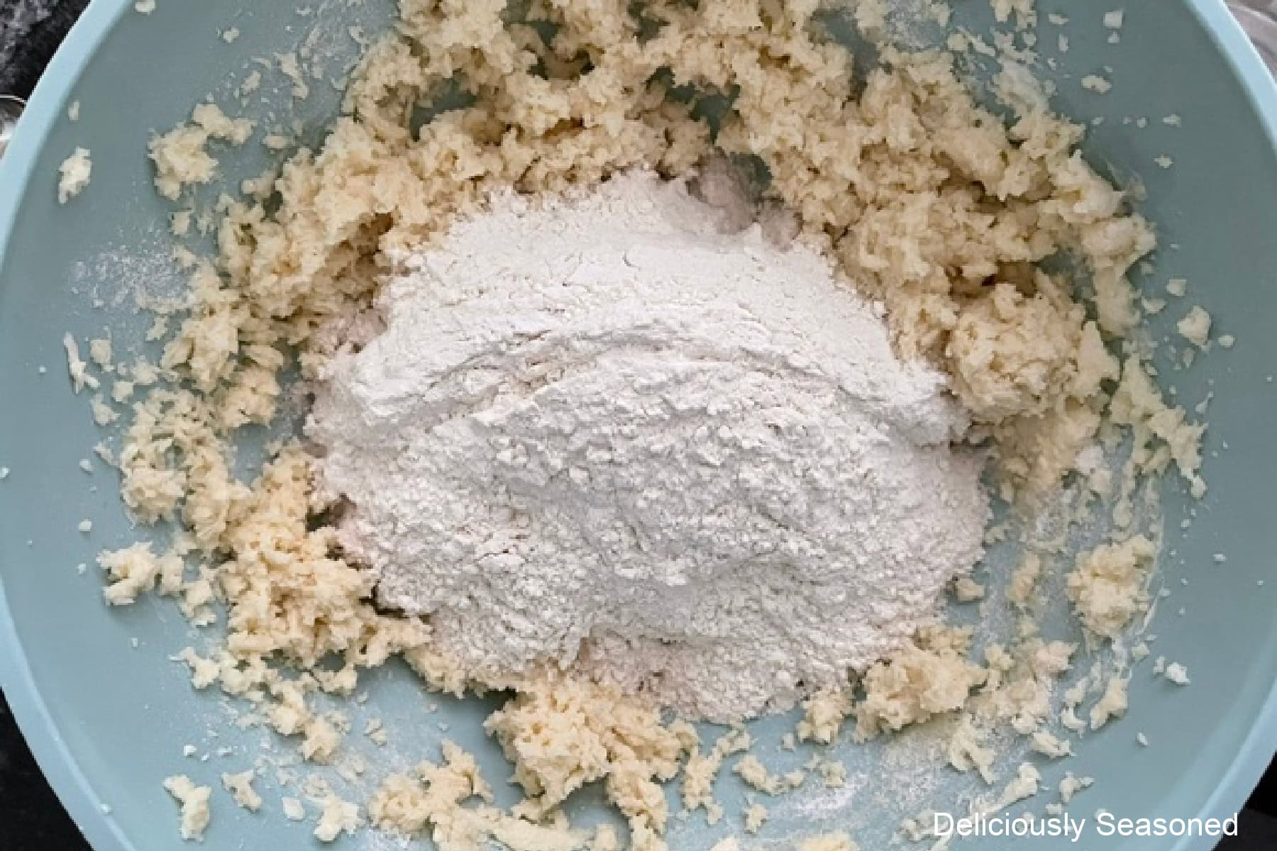 Dry ingredients added to the sugar cookie wet ingredient batter.