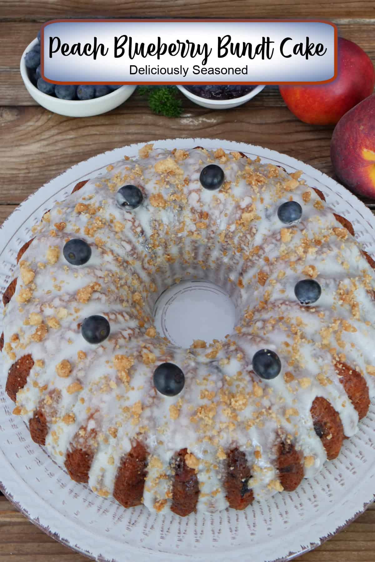 A white plate with a peach blueberry bundt cake on it with a title overlay at the top.
