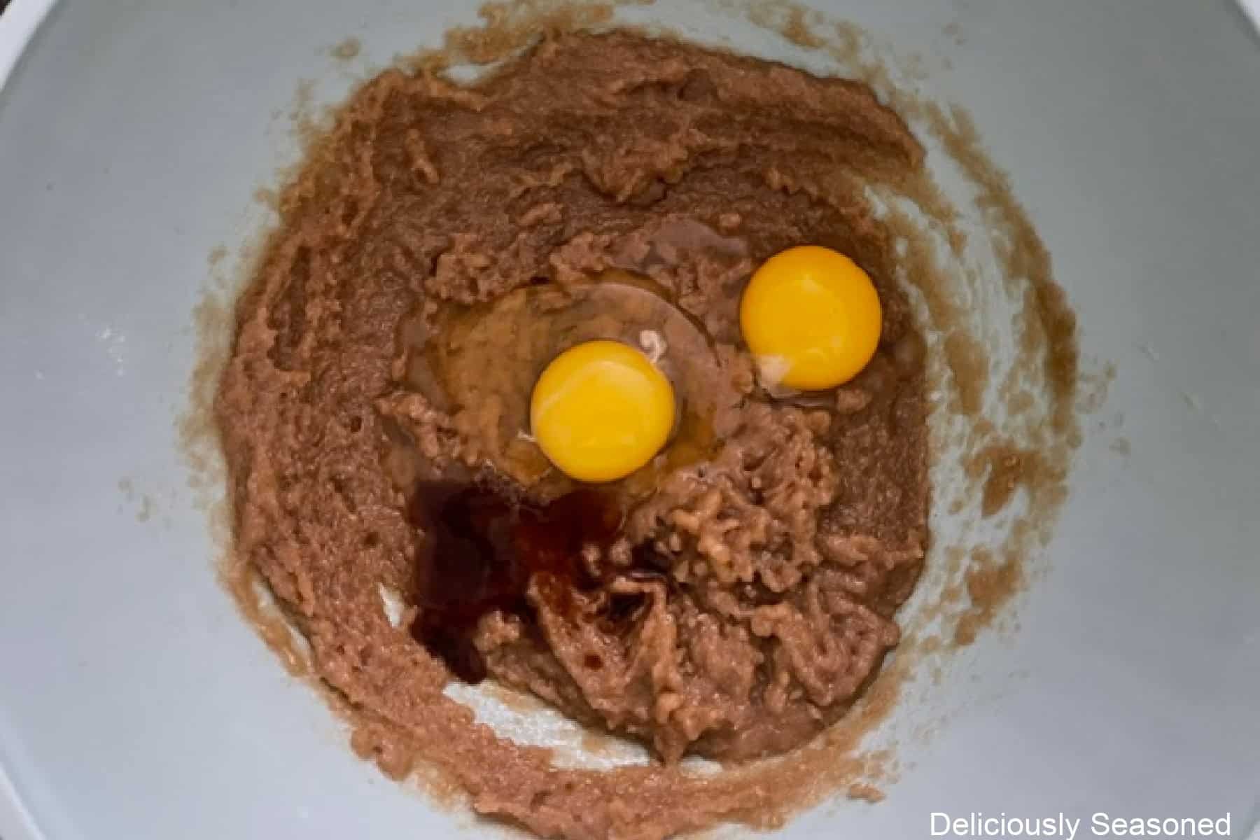 A mixing bowl with the wet ingredients in it to make funfetti blondies.