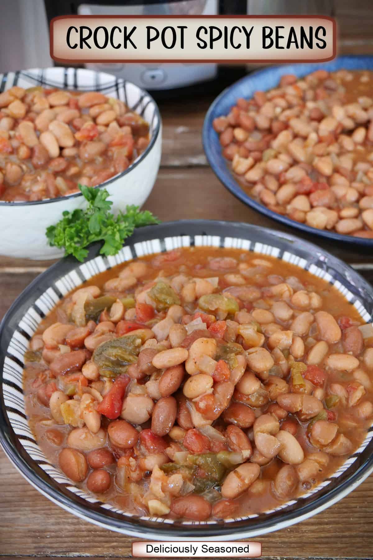 Three bowls of crock pot spicy beans and a title overlay at the top.